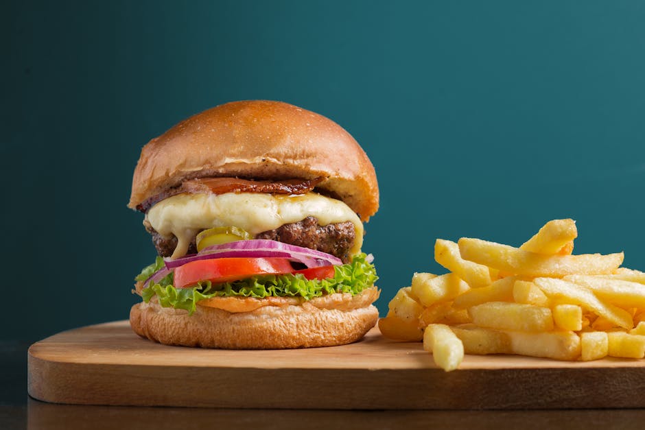 A delicious cheeseburger served with crispy golden french fries