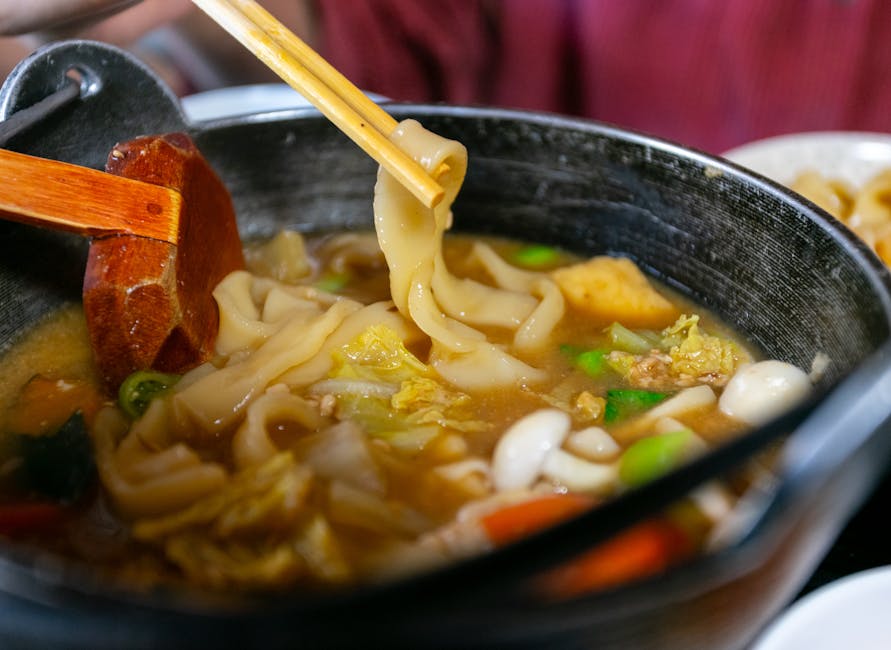 Delicious udon noodle soup with fresh vegetables and rich broth